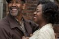 Imperfect hero: Denzel Washington as Troy, the trash man who is a tyrant in his own castle, with Viola Davis as his ...