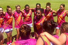 Kitara Farrar leads her Woomeras teammates in a game-time huddle (ABC News: Damian McIver)