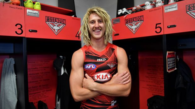 Boots 'n' all: there's no hiding Dyson Heppell's delight at being back in the Bombers locker room.