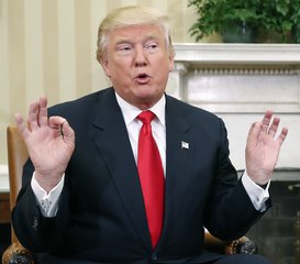 Donald Trump speaks during his meeting in the Oval Office of the White House