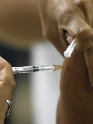 FILE - In this Jan. 9, 2008 file photo, a person is vaccinated against yellow fever at a public hospital in Brasilia, Brazil. Brazilâ€™s Health Ministry has ordered millions of doses of yellow fever vaccines to reinforce its stockpiles amid the largest outbreak of the disease the country has seen since 2000, the ministry said Wednesday, Jan. 25, 2017. (AP Photo/Eraldo Peres, File)