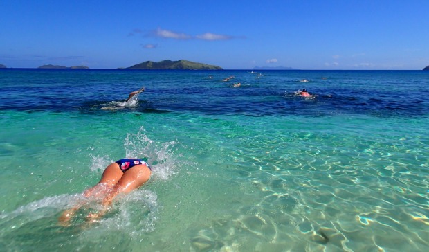 Dive in: the start of an Ocean Swim Safari on Mana Island, Fiji.