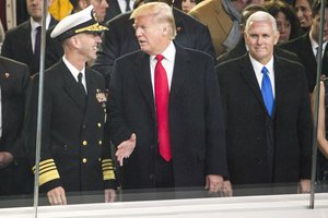 Adm. John M. Richardson, U.S. Navy chief naval operations, and President Donald J. Trump discuss U.S. Navy units marching in the 58th Presidential Inauguration Parade at the White House reviewing stand in Washington D.C., Jan. 20, 2017