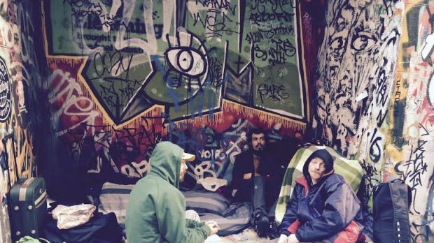 'We are homeless, not terrorists': Stuart Poden (pictured in blue) says of those who live in Hosier Lane.