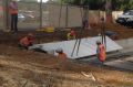 Workers have begun installing the first part of the memorial on Anzac Parade.