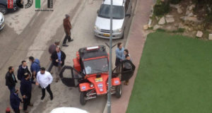 Settlers gathering on Shuhada Street, insulting and threatening Palestinians.