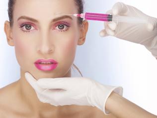 Portrait of fresh and beautiful woman getting botox injection