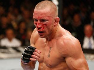 LAS VEGAS, NV - NOVEMBER 16: Georges St-Pierre stands in the Octagon during his UFC welterweight championship bout against Johny Hendricks during the UFC 167 event inside the MGM Grand Garden Arena on November 16, 2013 in Las Vegas, Nevada. (Photo by Josh Hedges/Zuffa LLC/Zuffa LLC via Getty Images)