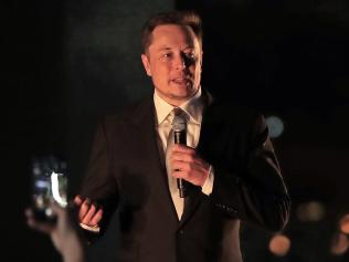 Elon Musk, the co-founder and chief executive of Electric carmaker Tesla, speaks during a ceremony in Dubai on February 13, 2017. Tesla announced the opening of a new Gulf headquarters in Dubai, aiming to conquer an oil-rich region better known for gas guzzlers than environmentally friendly motoring. / AFP PHOTO / KARIM SAHIB