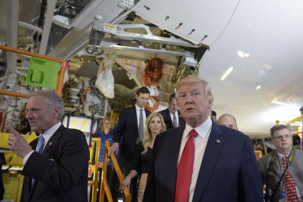 President Donald Trump tours the Boeing South Carolina facility in North Charleston, S.C., with South Carolina Gov. Henry McMaster, left, Friday, Feb. 17, 2017, to see the Boeing 787 Dreamliner. Trump is visiting Boeing before heading to his Mar-a-Lago estate in Palm Beach, Fla., for the weekend.