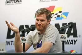 FILE - In this June 30, 2016, file photo, Dale Earnhardt Jr. gestures as he speaks during a news conference before the start of a NASCAR Sprint Cup auto racing practice at Daytona International Speedway, in Daytona Beach, Fla. NASCAR has a new sponsor, a new format and a familiar face this year in its bid to rebound from declining ratings and attendance. The next 11 months will show if Dale Earnhardt Jr., Monster Energy and different rules can provide the needed jolt.