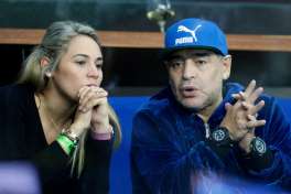 FILE - In this Nov. 25, 2016 file photo, former soccer player Diego Maradona of Argentina sits with his companion Rocio Oliva watching the Davis Cup finals tennis match in Zagreb, Croatia. Police say they were called to investigate an altercation involving Diego Maradona and a woman at a hotel in Madrid. on Wednesday Feb. 15, 2017 after a call from the hotel, but found no evidence of any disturbance after talking to Maradona and the woman.