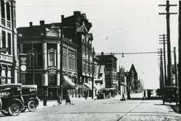 This 1887 photo was taken along Port Townsend's main drag downtown, Water Street. The photo is looking east from Taylor Street. The building on the left with the visible "1884 McCurdy" still stands, though it would be hard to recognize if not for the sign. Just out of frame to the right is the Hastings Building, perhaps one of the most recognizable buildings in downtown. Photo courtesy Washington State Archives.