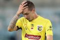 CANBERRA, AUSTRALIA - NOVEMBER 12: Storm Roux of the Mariners looks dejected after defeat during the round six A-League ...
