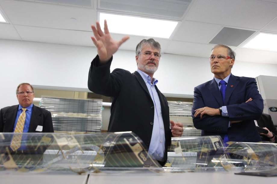 J. Devin MacKenzie, Director of the new Washington Clean Energy Testbeds, gives a tour of the 15,000 square foot facility to Governor Jay Inslee during an opening event, Thursday, Feb. 16, 2017.  Researchers at the facility will work on clean energy technology and innovation, including printable, low-cost solar cells, new battery systems and energy management software. Photo: GENNA MARTIN, SEATTLEPI.COM / SEATTLEPI.COM