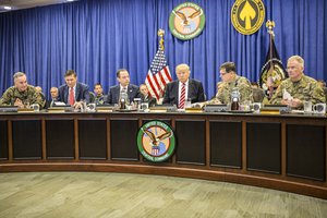 President Donald Trump discusses current military operations with Gen. Joseph Votel, commander of U.S. Central Command Commander, at MacDill, AFB, FL, Feb. 6, 2017