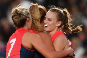 Dee crush: Alyssa Mifsud of the Demons is enjoys a goal with teammates on Saturday night.