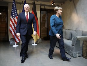 United States Vice President Mike Pence, left, and German Chancellor Angela Merkel meet for bilateral talks during the Munich Security Conference in Munich, Germany