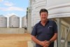 The Lupin Co co-owner Rod Birch standing by his lupin flake silos.