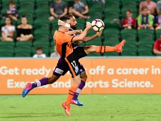 Matt McKay of the Roar and Diego Castro of the Glory contest the ball. Picture: Stefan Gosatti/Getty Images