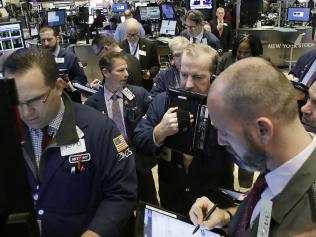 Stock traders follow market activity, Thursday, Feb. 9, 2017, at the New York Stock Exchange. (AP Photo/Mark Lennihan)