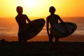 Getting in early: young surfers head an early dip at Cronulla Beach on Thursday morning.