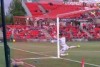 Reds keeper John Hall crashed face-first into the goal post.