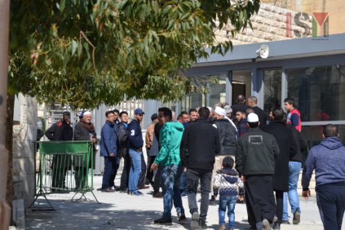 Palestinians are waiting to pass through the new checkpoint at al-Ibrahimi mosque