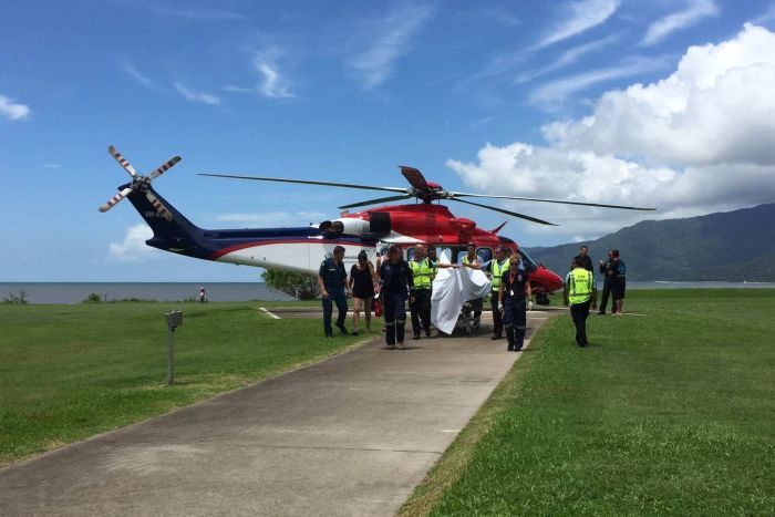 Rescue helicopter carrying man attacked by shark arrives at Cairns Hospital