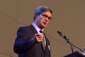 Upshot of WA Treasurer Mike Nahan in front of microphones.