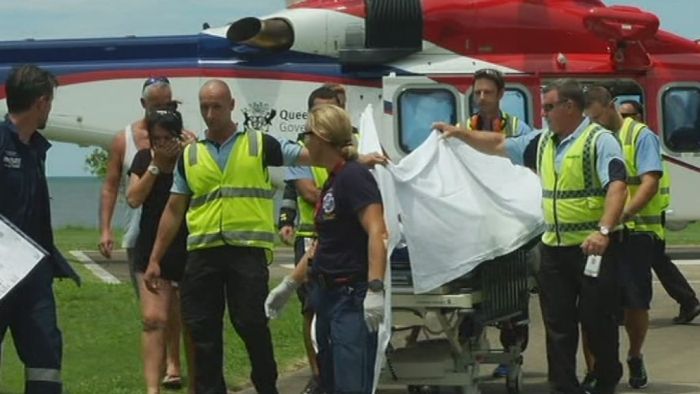 Shark attack victim Glenn Dickson arrives at Cairns Hospital for treatment