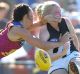 Sarah D'Arcy of the Magpies gets a kick away.