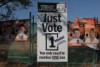 a sign saying just vote one in election font