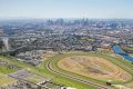 An artist's impression of planned apartment towers next to Flemington Racecourse railway station. 