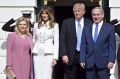 Benjamin Netanyahu, from right, and Donald Trump stand with their wives Melania Trump and Sara Netanyahu.