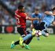 SYDNEY, AUSTRALIA - FEBRUARY 18: Rhyan Grant of Sydney FC is tacked by Bruno Pinatares of the Wanderers during the round ...