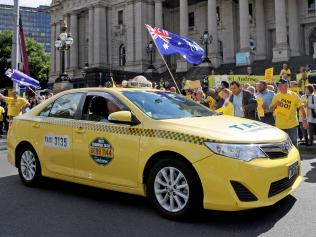 Taxi drivers protest outside Parliament house in Melbourne over Government deregulation plans for the Taxi industry, in Melbourne, Monday, Feb. 13, 2017. (AAP Image/Joe Castro) NO ARCHIVING