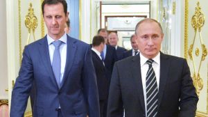 In this photo taken on Tuesday, Oct. 20, 2015, Russian President Vladimir Putin, right, and Syria President Bashar Assad ...