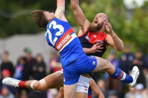 Jordan Roughead and Max Gawn in action. Roughead later hurt his knee.