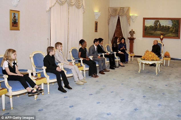 All in attendance: Also pictured were eight-year-old twins Knox and Vivienne (far left) as they attended an audience with Cambodian King Norodom Sihamoni