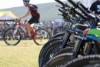 A man on a mountain bike, with a row of bikes to his right.