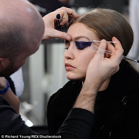 Makeover: Before getting to the finished article, she was seen backstage at every step of her makeover with the fashion team's stylists, make-up artists and hairstylists, working their magic to transform the runway golden girl