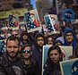 People carry posters during a rally in support of Muslim Americans and protest of President Donald Trump's immigration policies in Times Square, New York, Sunday, Feb. 19, 2017. (AP Photo/Andres Kudacki)