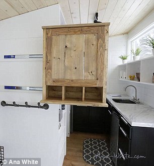 A cabinet in the welcome area slides out to serve secondly as a pantry for the kitchen