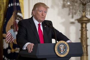 President Donald Trump pauses while speaking during a news conference in the East Room of the White House in Washington