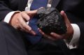 Treasurer Scott Morrison with a lump of coal during question time.