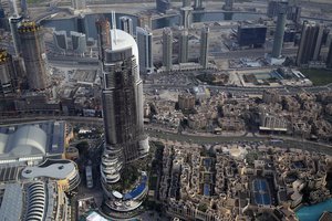 In this Sunday, Jan. 10, 2016 photo, the burned hulk of The Address Downtown is seen in Dubai, United Arab Emirates.