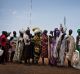 Women who fled fighting in nearby Leer in recent months, queue for food aid at a food distribution made by the World ...