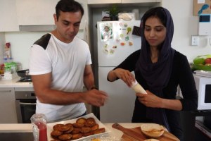 Aneela Younis and her husband Fahd are perfecting their Pakistani egg burger technique (ABC: Barbara Miller)