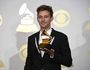 Flume poses in the press room with the award for best dance/electronic album for "Skin" at the 59th annual Grammy Awards at the Staples Center on Sunday, Feb. 12, 2017, in Los Angeles.